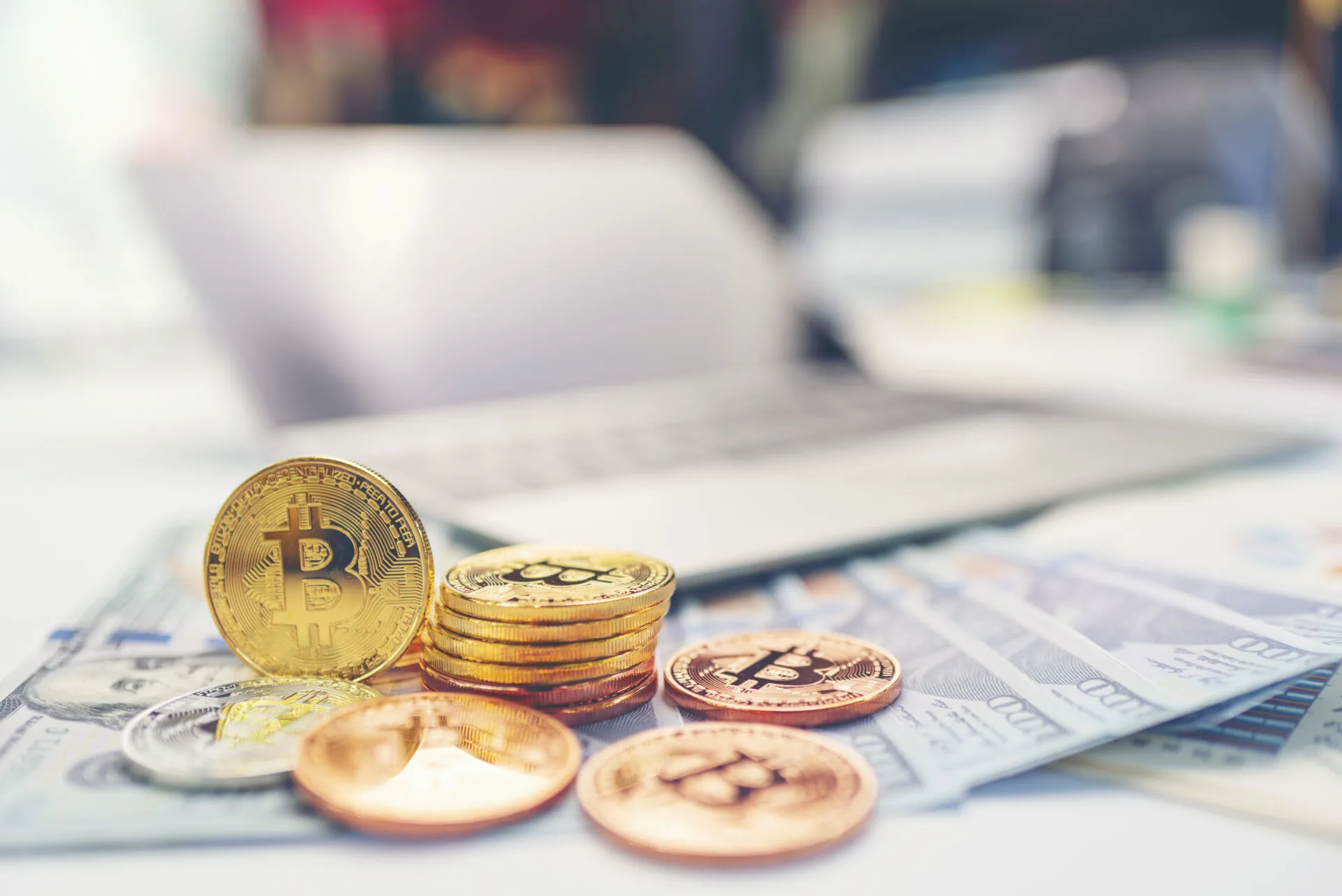 Bitcoin Cryptocurrency Coins and Laptop Computer